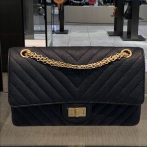Authentic brand new Chanel 2.55 reissue flap bag.